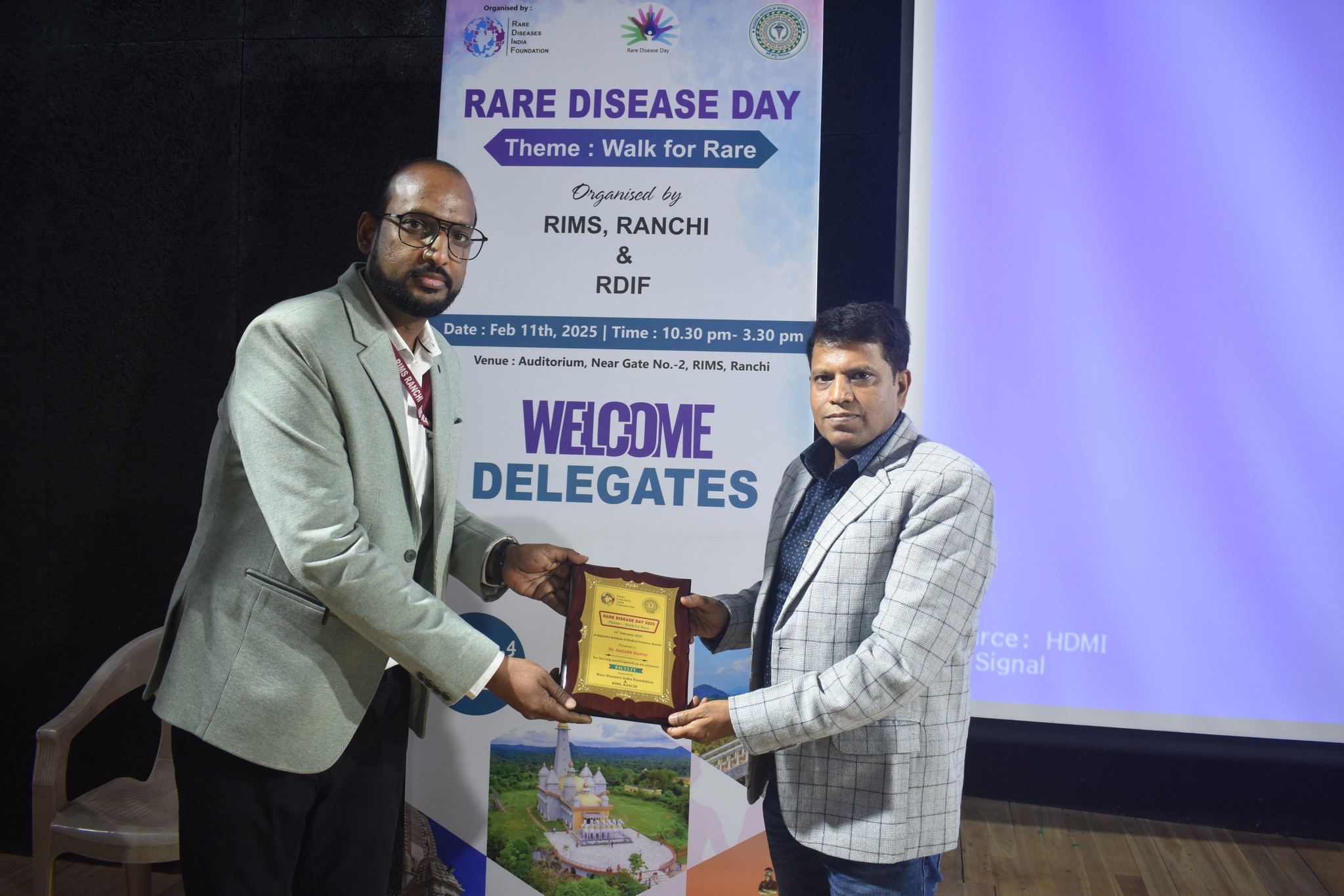 Attendees lighting candles in a ceremony of hope.